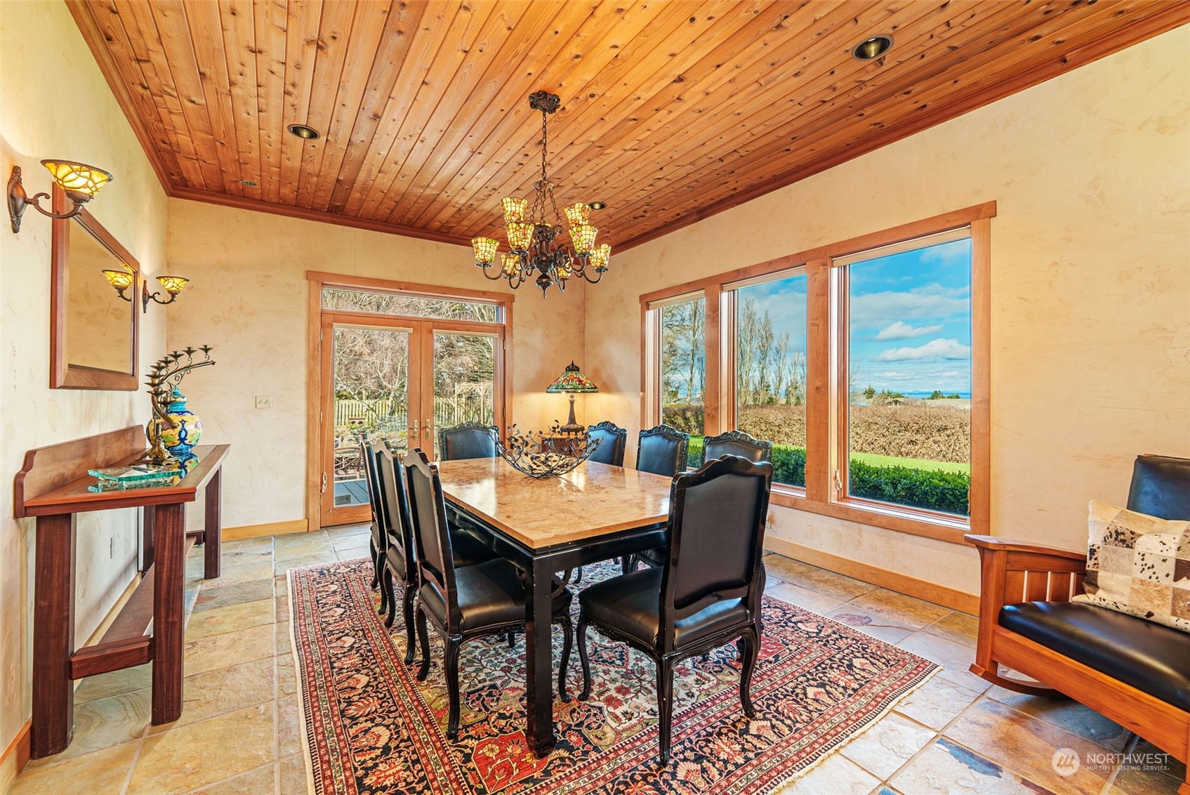 2325 Cays Road Sequim, WA 98382 - Photo 10 of 36 a dining room with furniture a chandelier and wooden floor