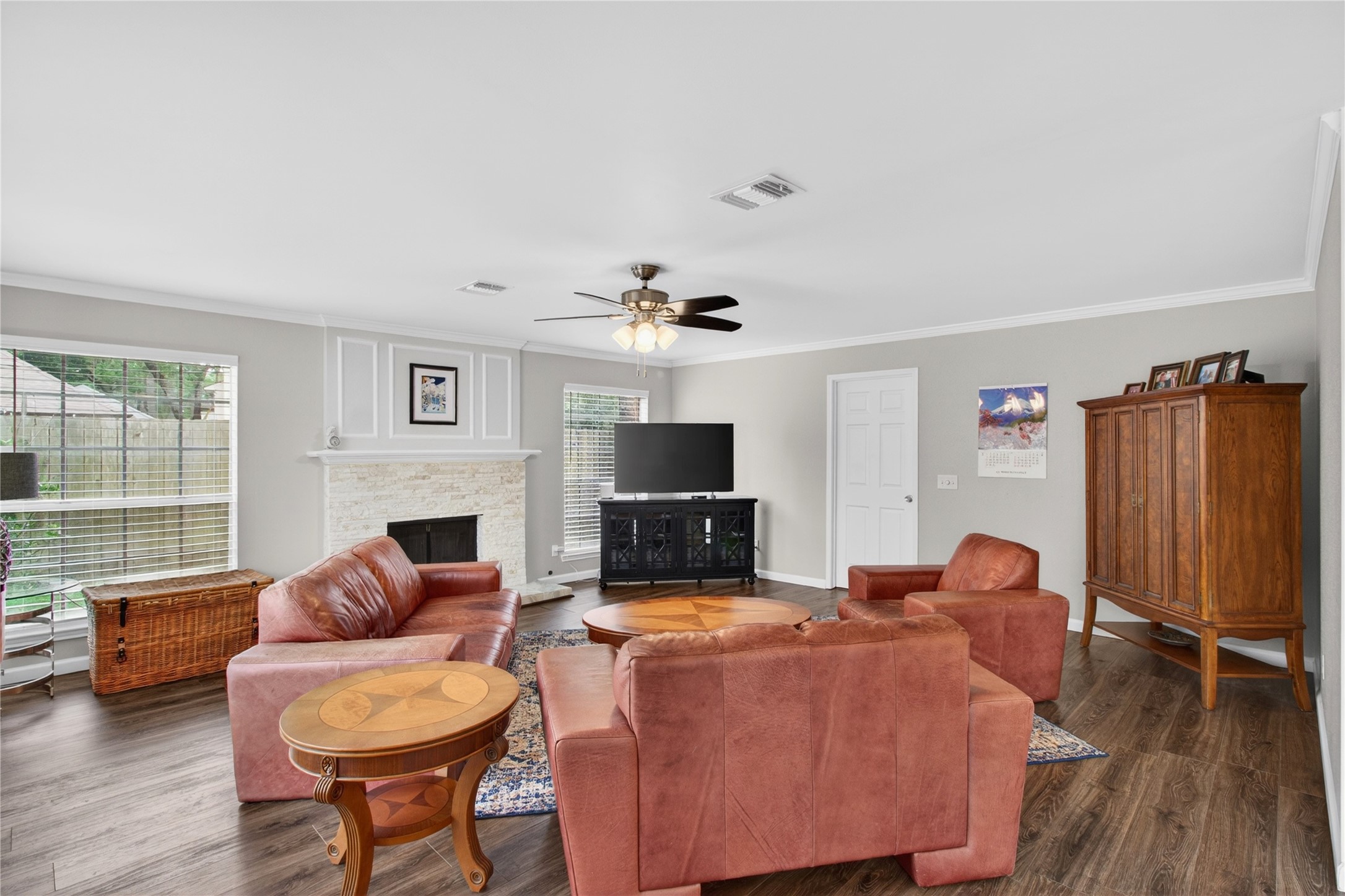 20214 Woodsboro Court Spring, TX 77388 - Photo 18 of 50 Family Room w/Recently Updated Wood-burning Fireplace w/gas connection! Doorway to Laundry Rm & Extra Rm connecting to Garage! Recently Painted Interior! Luxury Vinyl Plank throughout 1st Floor!