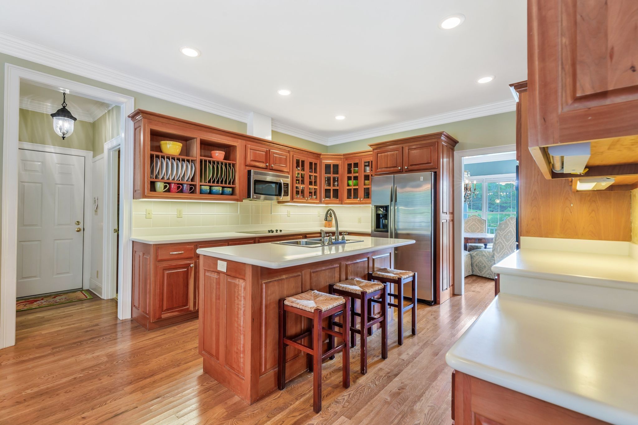 1036 Reed Hollow Road Readyville, TN 37149 - Photo 26 of 90 an open kitchen with granite countertop a stove and a wooden floors