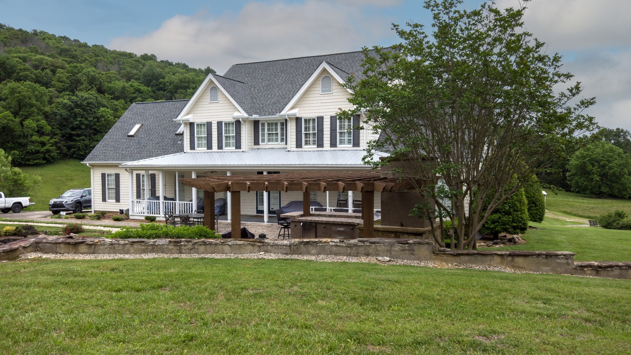 1036 Reed Hollow Road Readyville, TN 37149 - Photo 86 of 90 a front view of a house with garden and trees