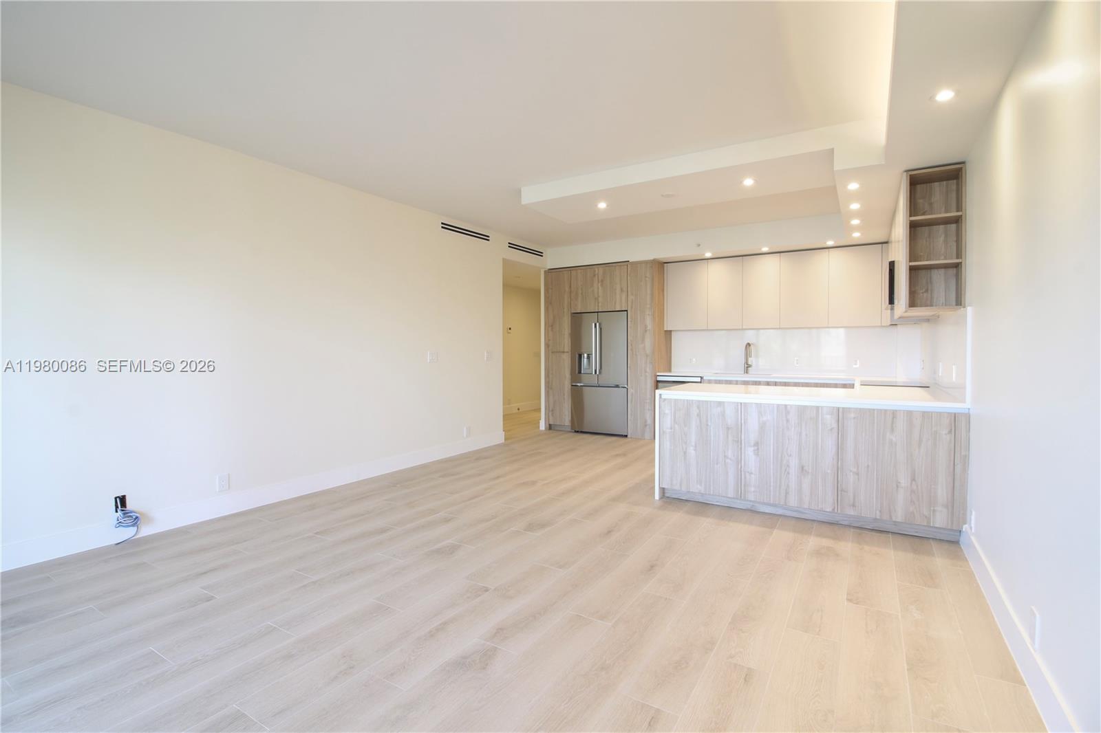151 Crandon Boulevard, Unit 540 Key Biscayne, FL 33149 - Photo 22 of 41 a view of a kitchen with a sink and a refrigerator