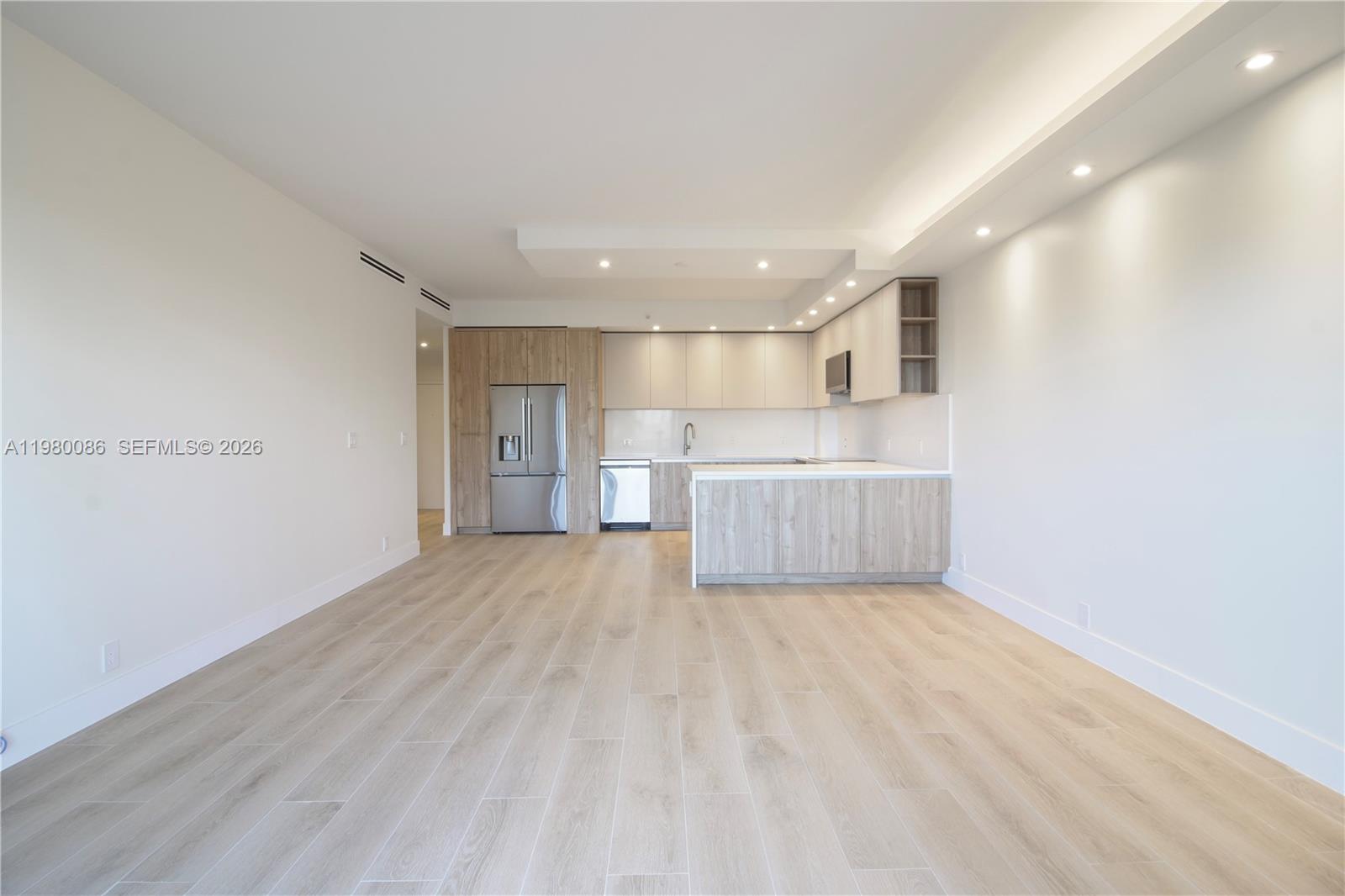 151 Crandon Boulevard, Unit 540 Key Biscayne, FL 33149 - Photo 24 of 41 a view of a kitchen with a sink and a refrigerator