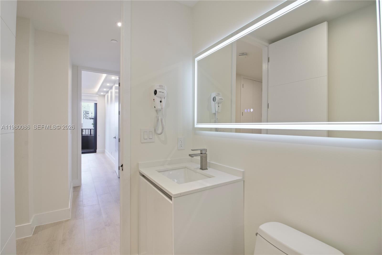 151 Crandon Boulevard, Unit 540 Key Biscayne, FL 33149 - Photo 30 of 41 a bathroom with a sink a toilet and shower