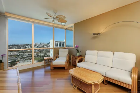 a balcony with furniture and city view
