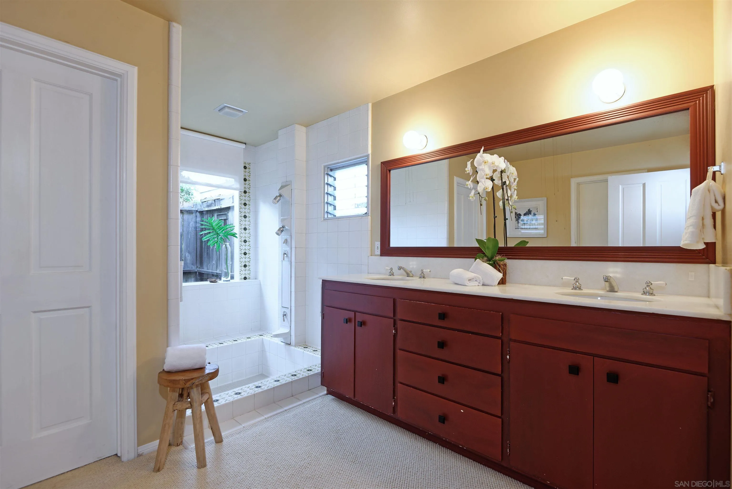 1780 La Jolla Rancho Road La Jolla, CA 92037 - Photo 14 of 24 a spacious bathroom with a double vanity sink and a mirror
