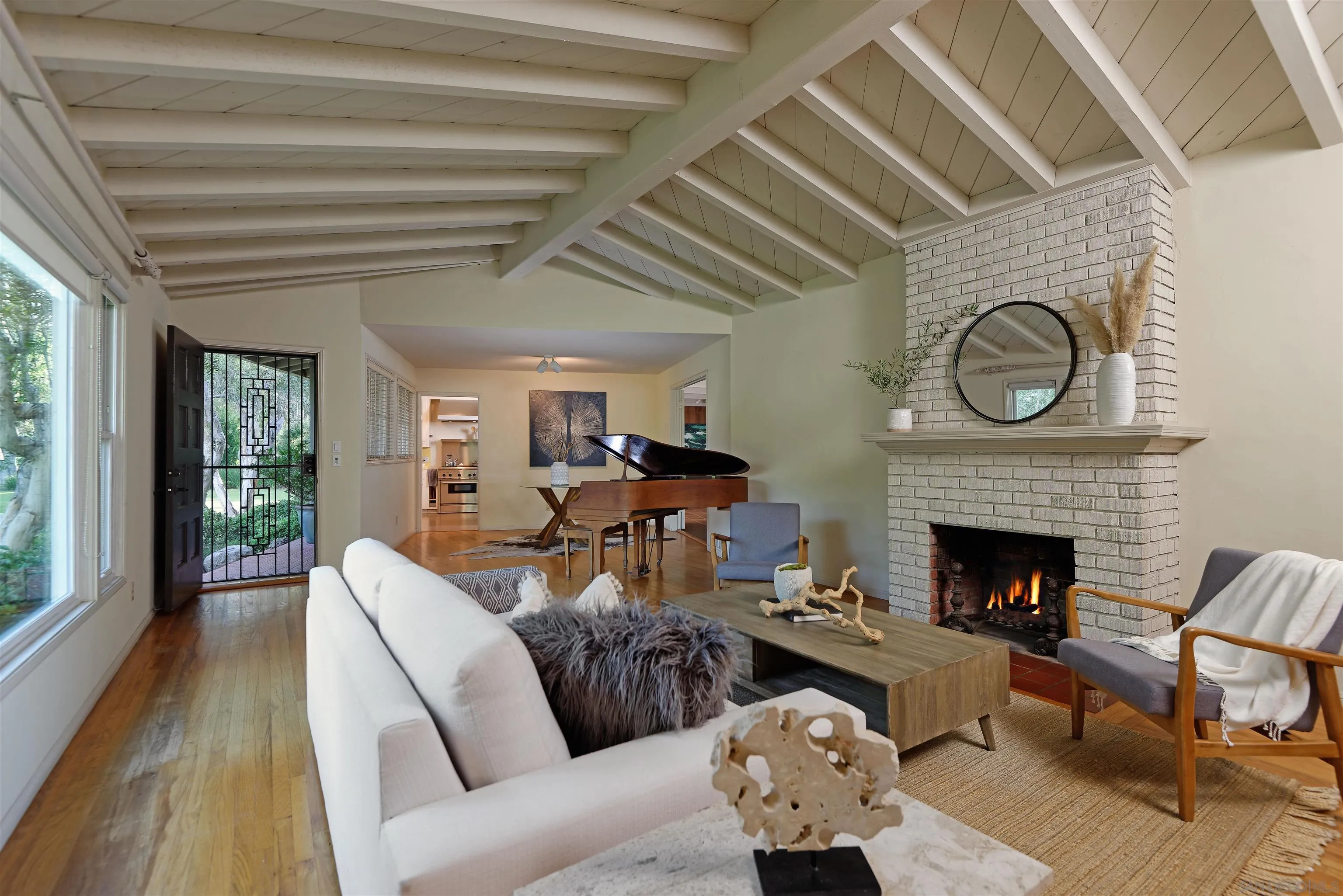 1780 La Jolla Rancho Road La Jolla, CA 92037 - Photo 6 of 24 a living room with furniture and a fireplace