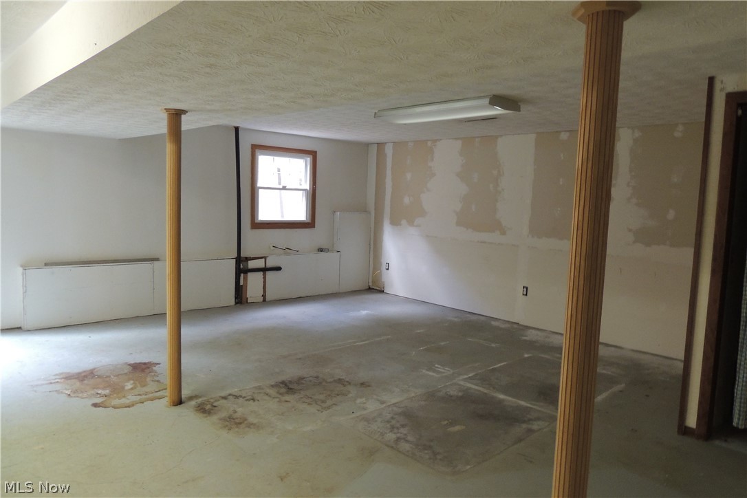 11550 Chamberlain Road Mantua, OH 44255 - Photo 15 of 24 Family room in the lower level with walkout patio door.