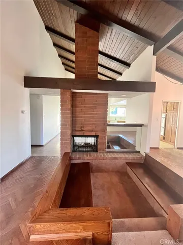 a kitchen with furniture and a fireplace