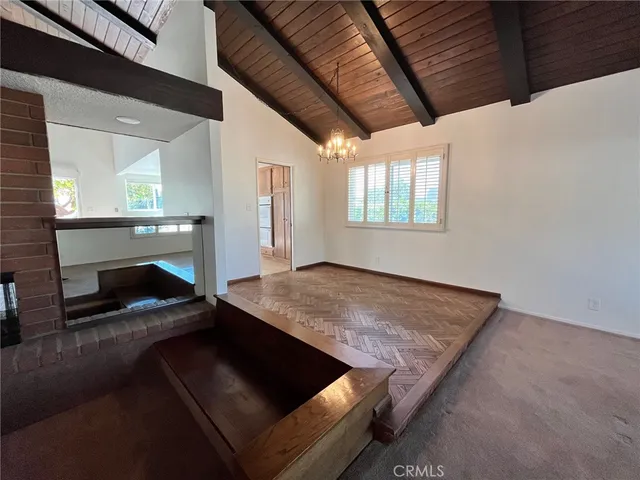 a view of an empty room with a fireplace