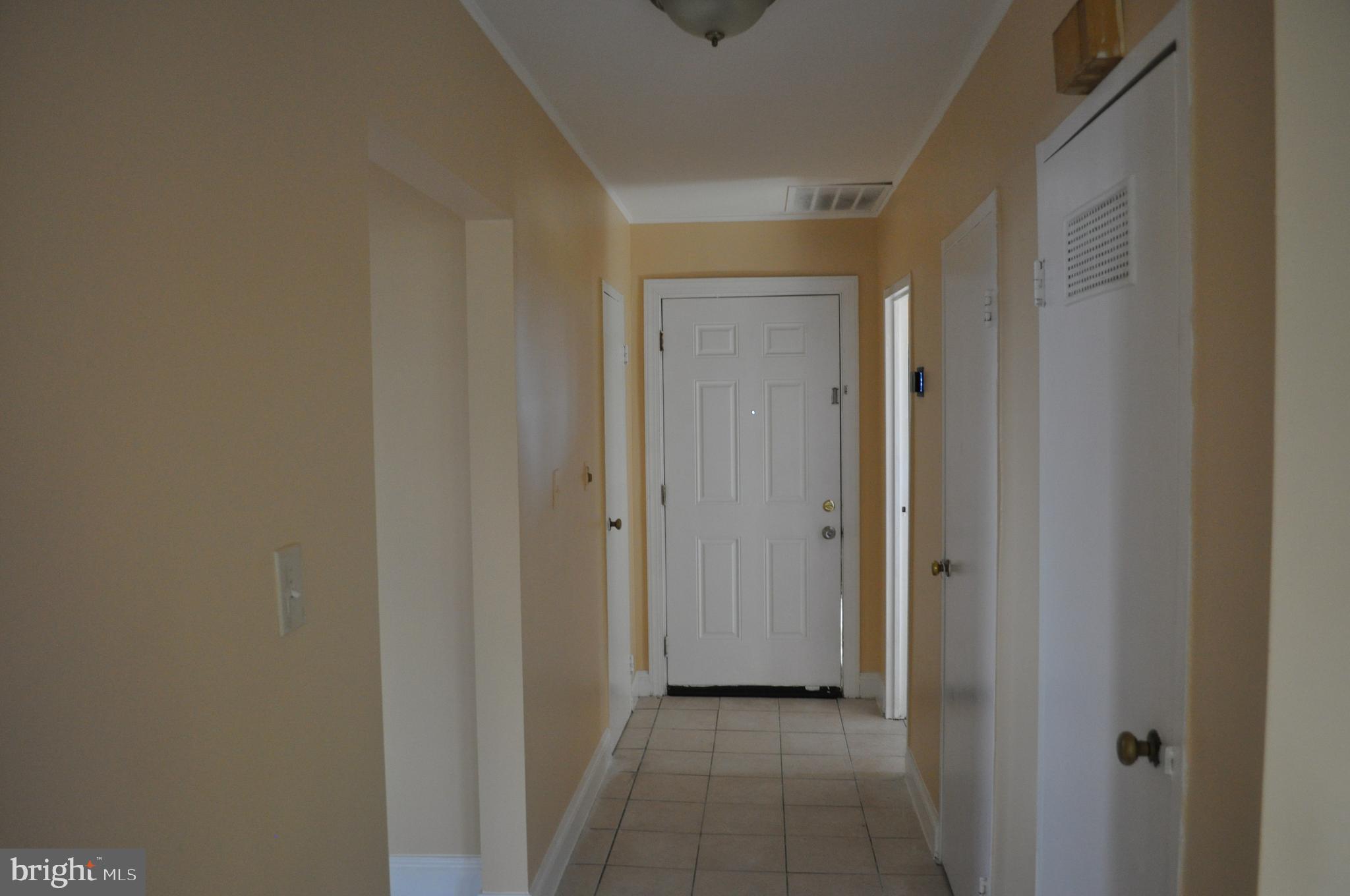 1108 Navahoe Drive Silver Spring, MD 20903 - Photo 14 of 14 a view of a hallway with closet and wooden floor