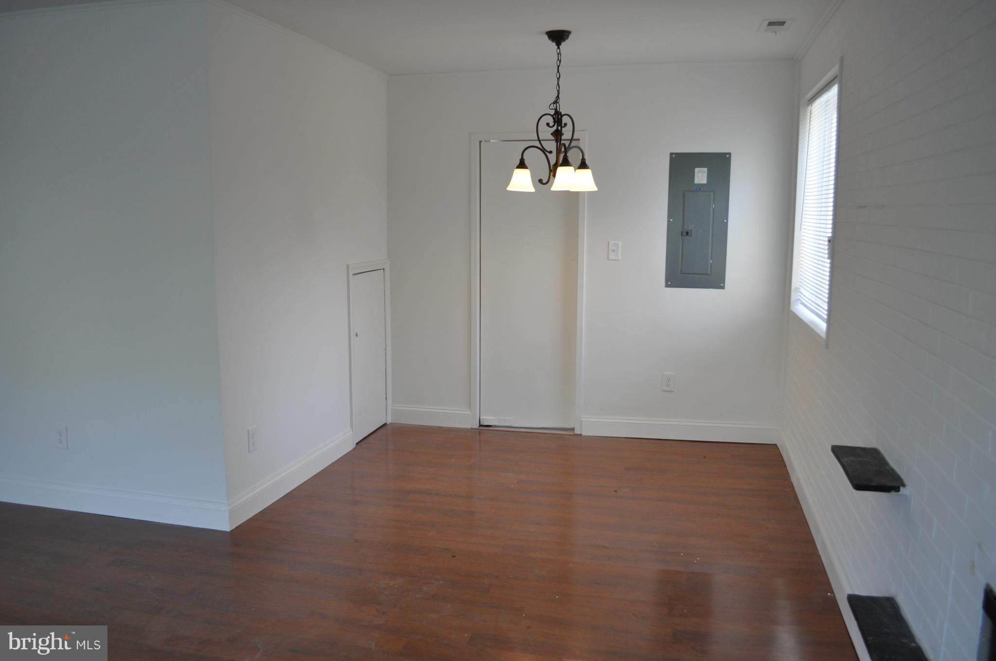 1108 Navahoe Drive Silver Spring, MD 20903 - Photo 6 of 14 a view of an empty room with a window