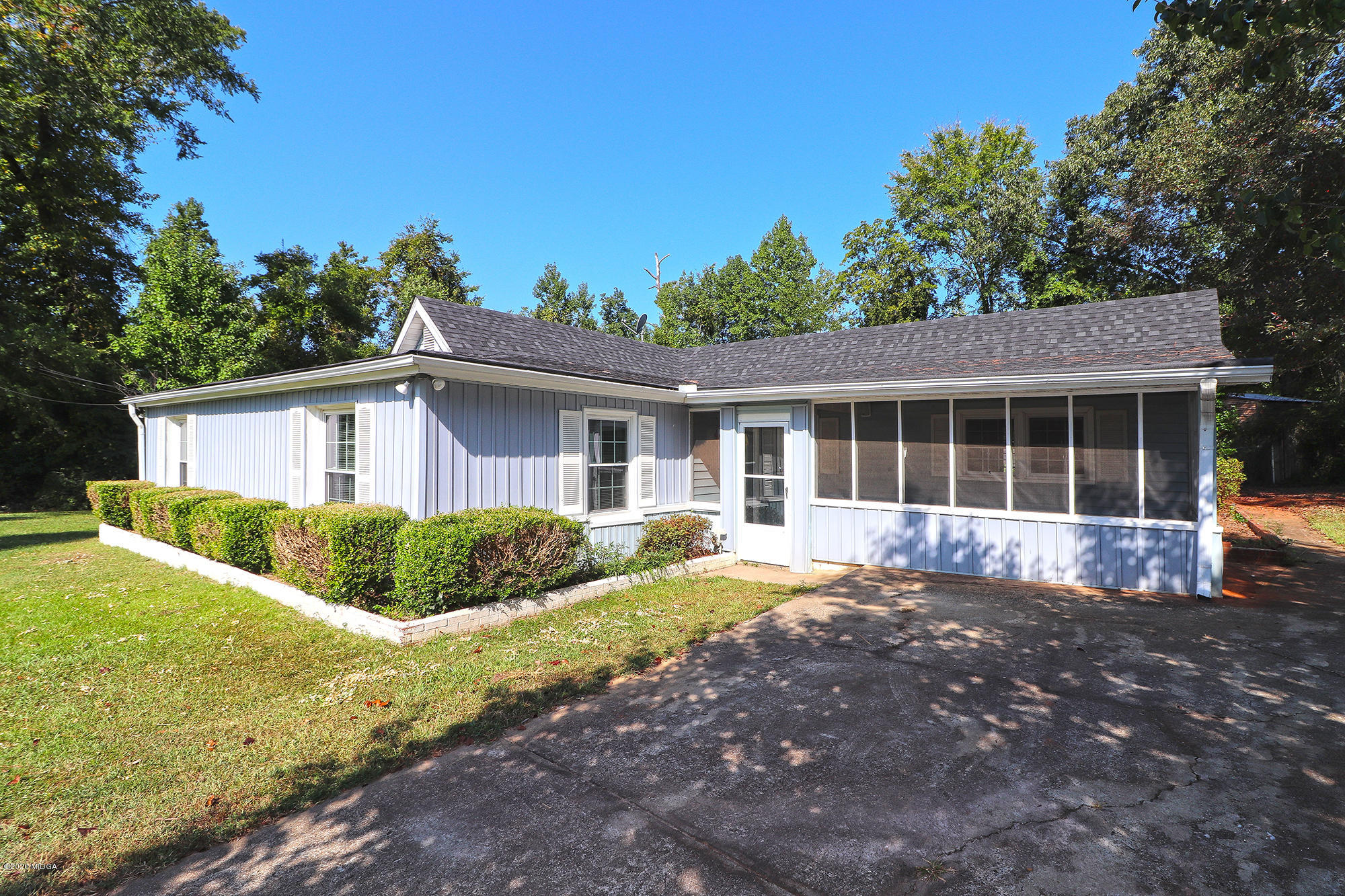a front view of a house with a yard and porch