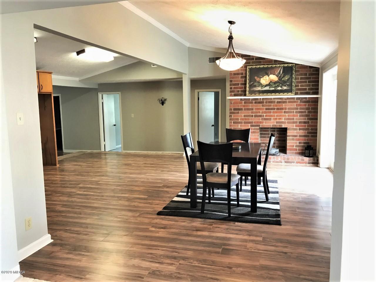6669 Goodall Mill Road Macon, GA 31216 - Photo 11 of 28 a view of a dining room with furniture and wooden floor