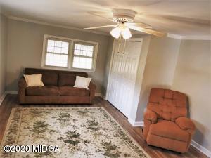 6669 Goodall Mill Road Macon, GA 31216 - Photo 12 of 28 a bedroom with a bed and window