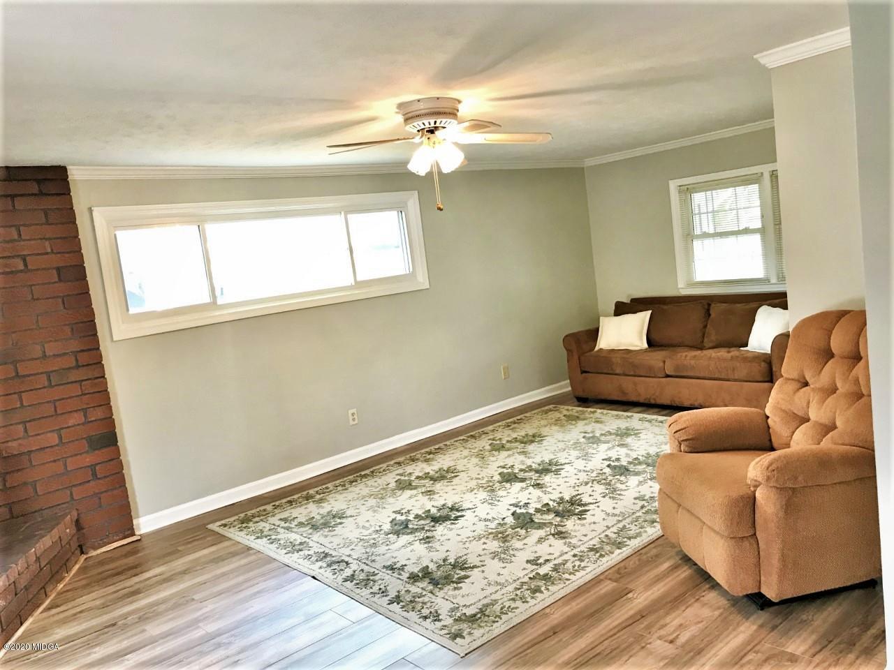 6669 Goodall Mill Road Macon, GA 31216 - Photo 13 of 28 a living room with furniture and a window