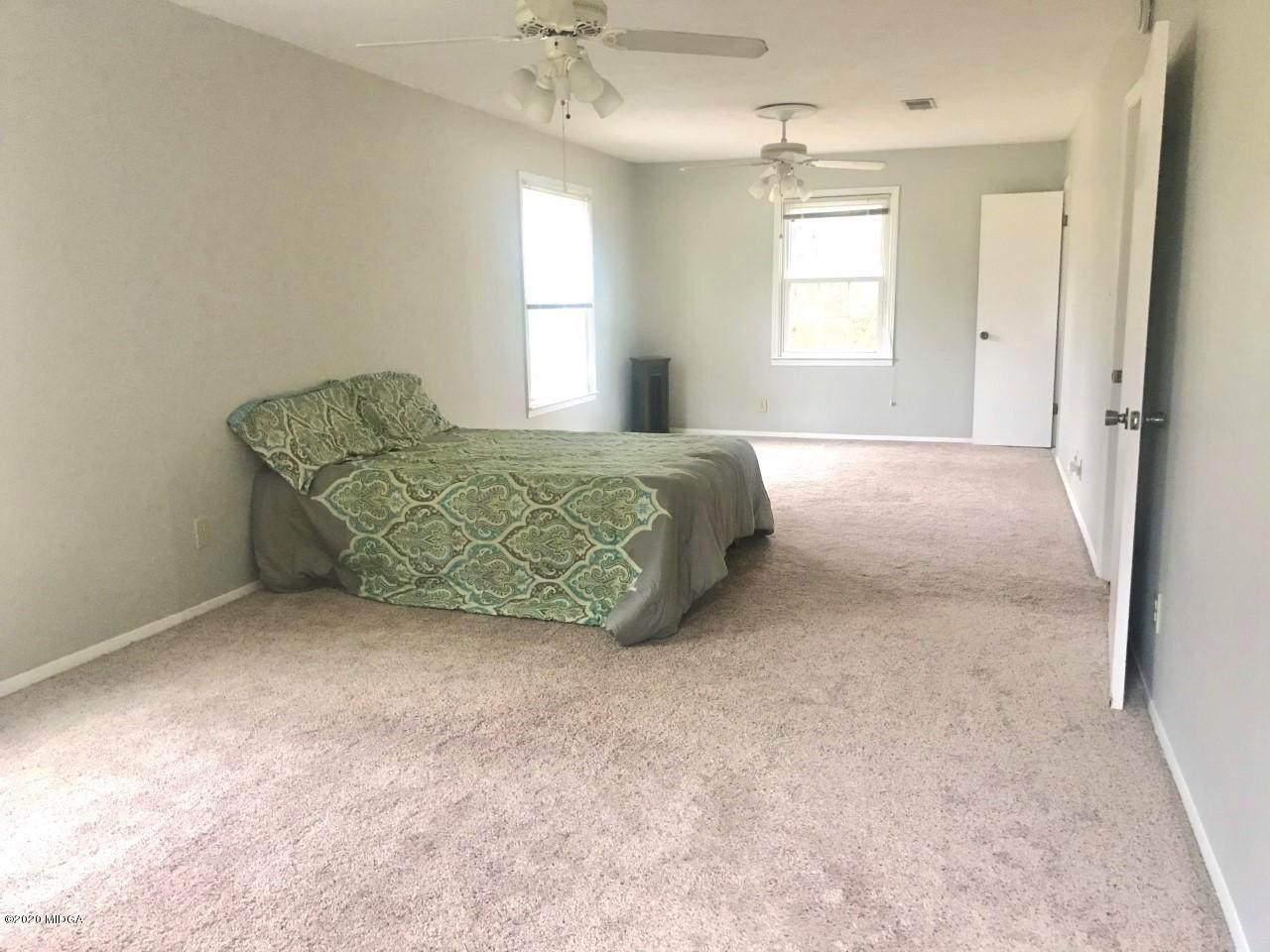 6669 Goodall Mill Road Macon, GA 31216 - Photo 16 of 28 a living room with furniture and a window