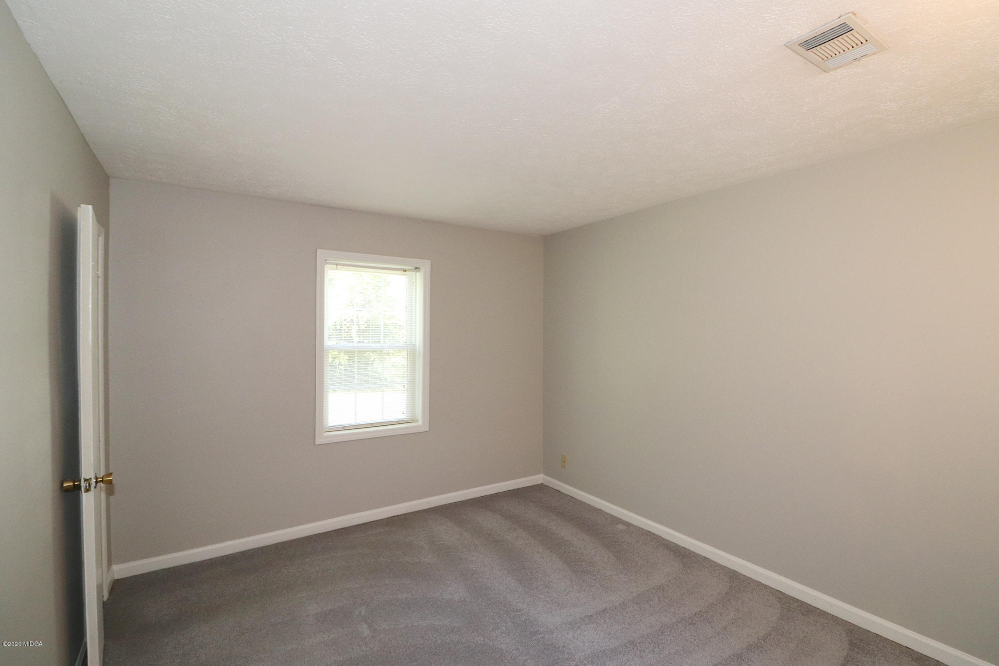 6669 Goodall Mill Road Macon, GA 31216 - Photo 20 of 28 a view of a window in an empty room