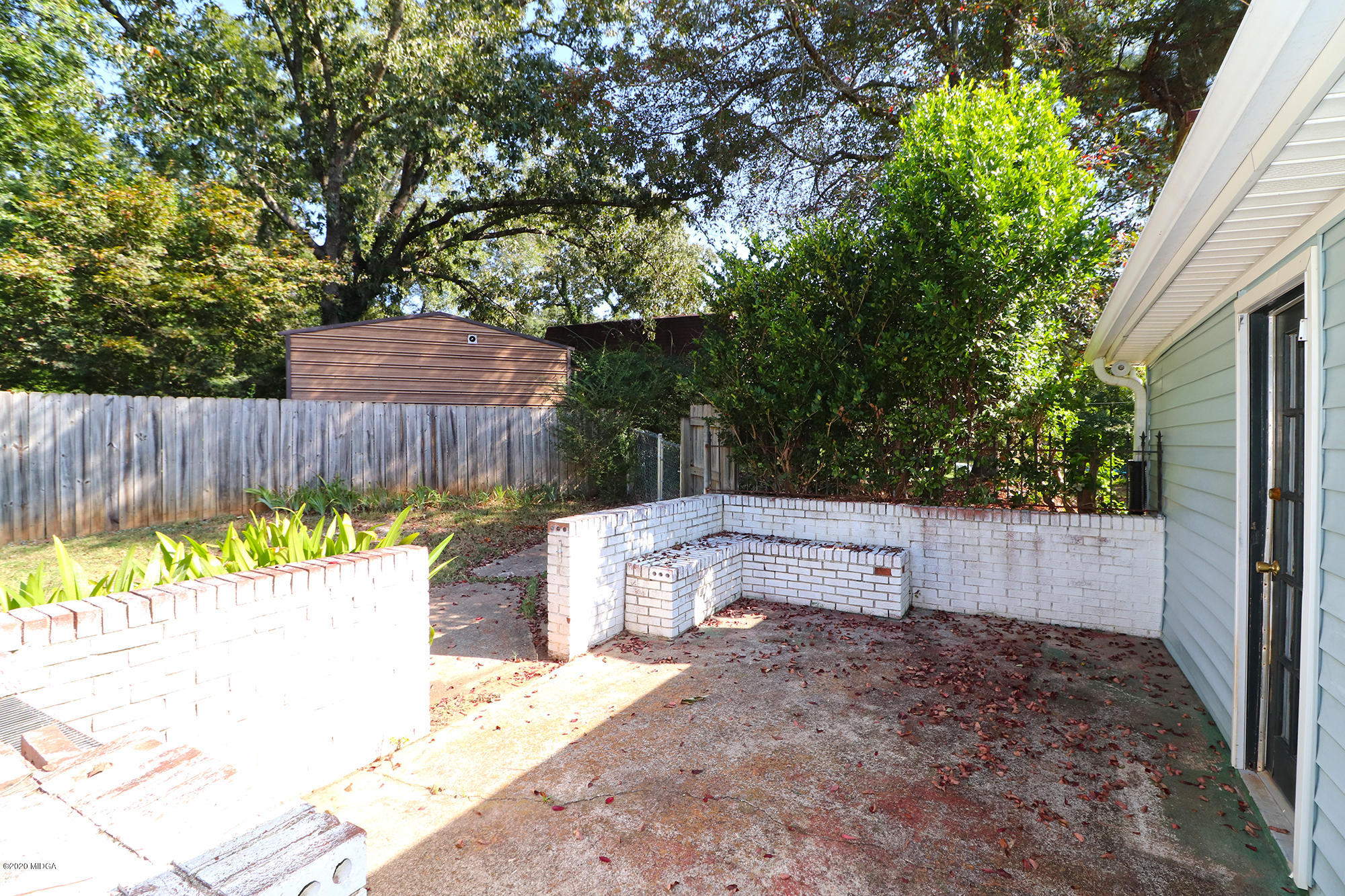 6669 Goodall Mill Road Macon, GA 31216 - Photo 22 of 28 a view of a backyard with a tub and trees