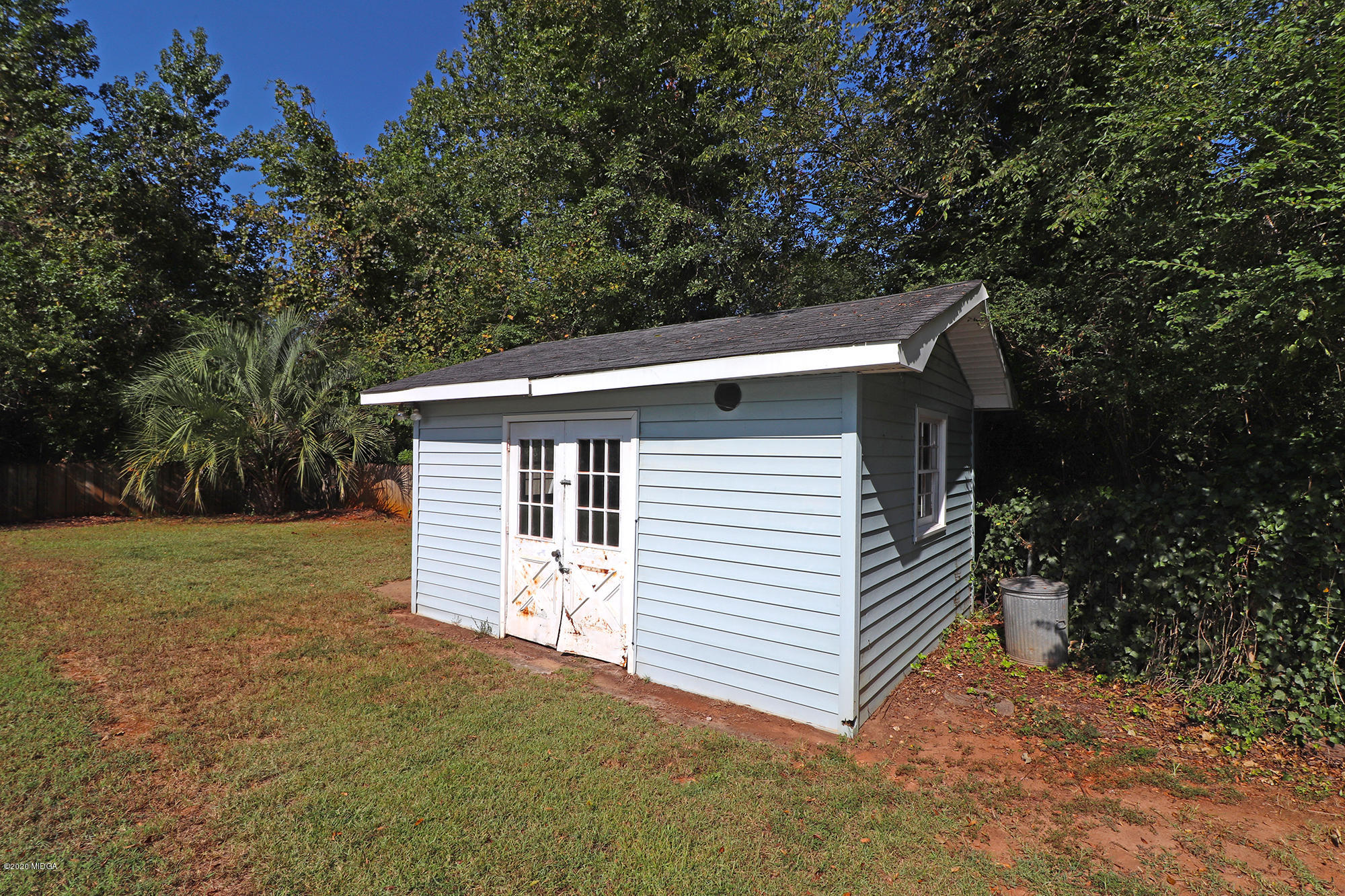 6669 Goodall Mill Road Macon, GA 31216 - Photo 24 of 28 a view of a house with a yard and garage