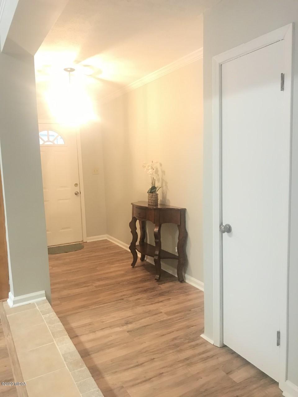 6669 Goodall Mill Road Macon, GA 31216 - Photo 7 of 28 a room with a bench and chair