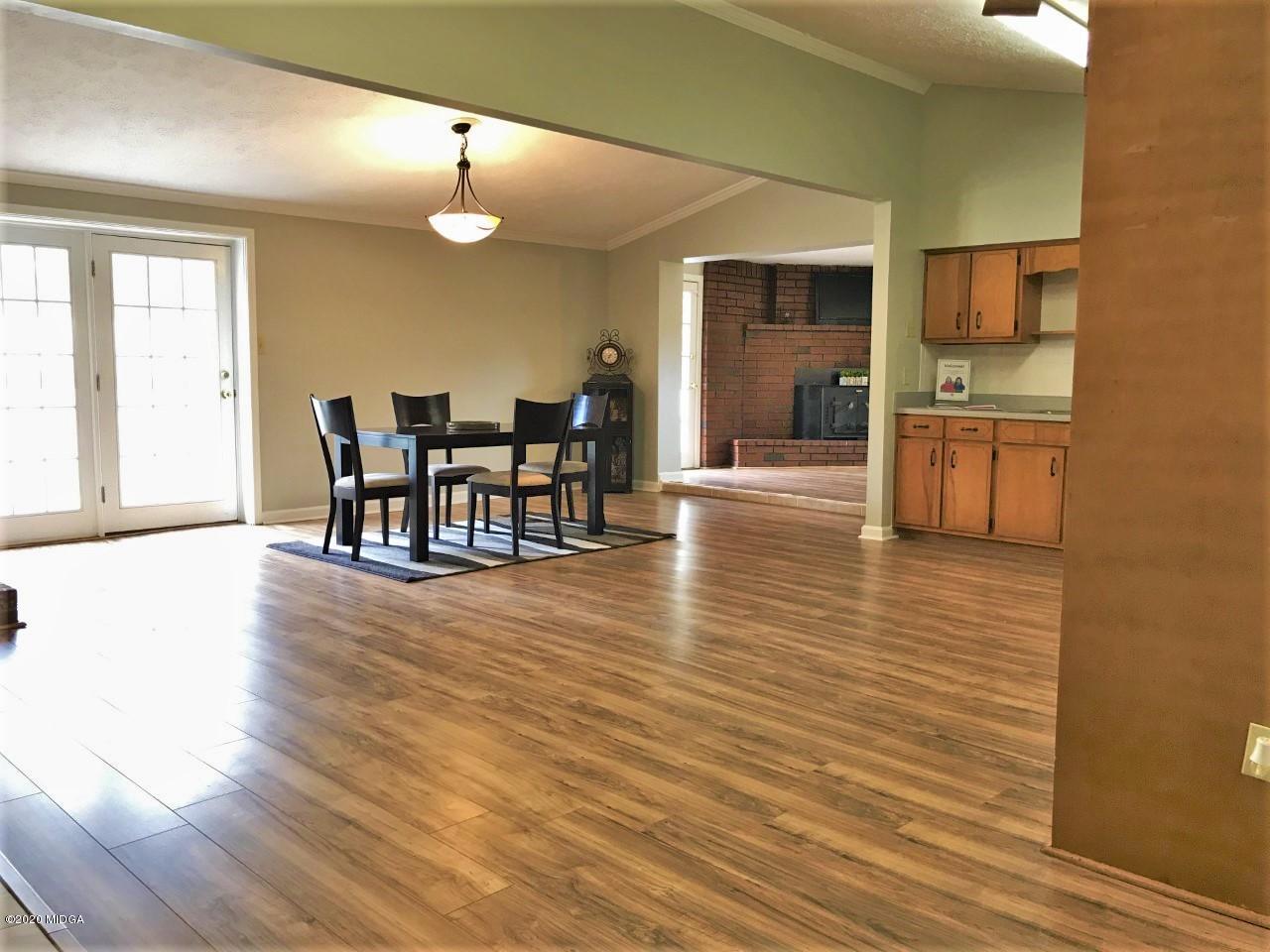 6669 Goodall Mill Road Macon, GA 31216 - Photo 8 of 28 a view of a dining room with furniture and wooden floor