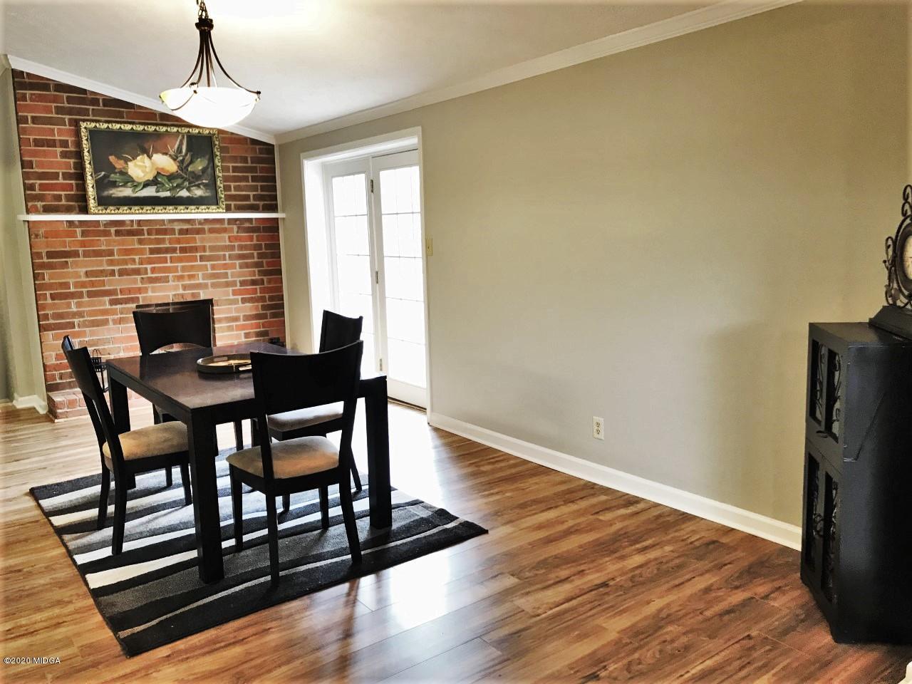 6669 Goodall Mill Road Macon, GA 31216 - Photo 10 of 28 a dining room with furniture window and wooden floor