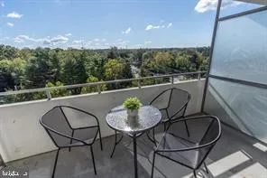 a view of a chairs and table in patio