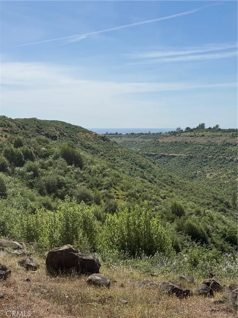 0 Round Valley Ranch Road Paradise, CA 95969 - Photo 7 of 33 a view of a field with an ocean and trees