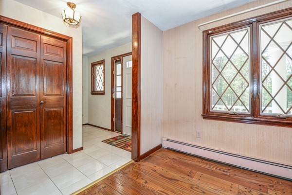 312 Depot Road Boxborough, MA 01719 - Photo 4 of 30 a view of empty room with wooden floor and fan