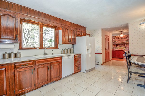 312 Depot Road Boxborough, MA 01719 - Photo 6 of 30 a kitchen with a sink refrigerator and cabinets