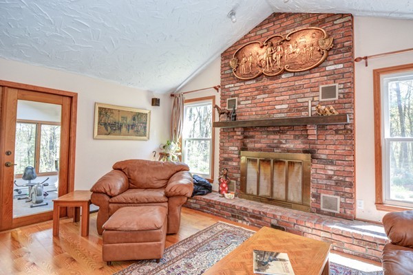 312 Depot Road Boxborough, MA 01719 - Photo 10 of 30 a living room with furniture a window and a fireplace
