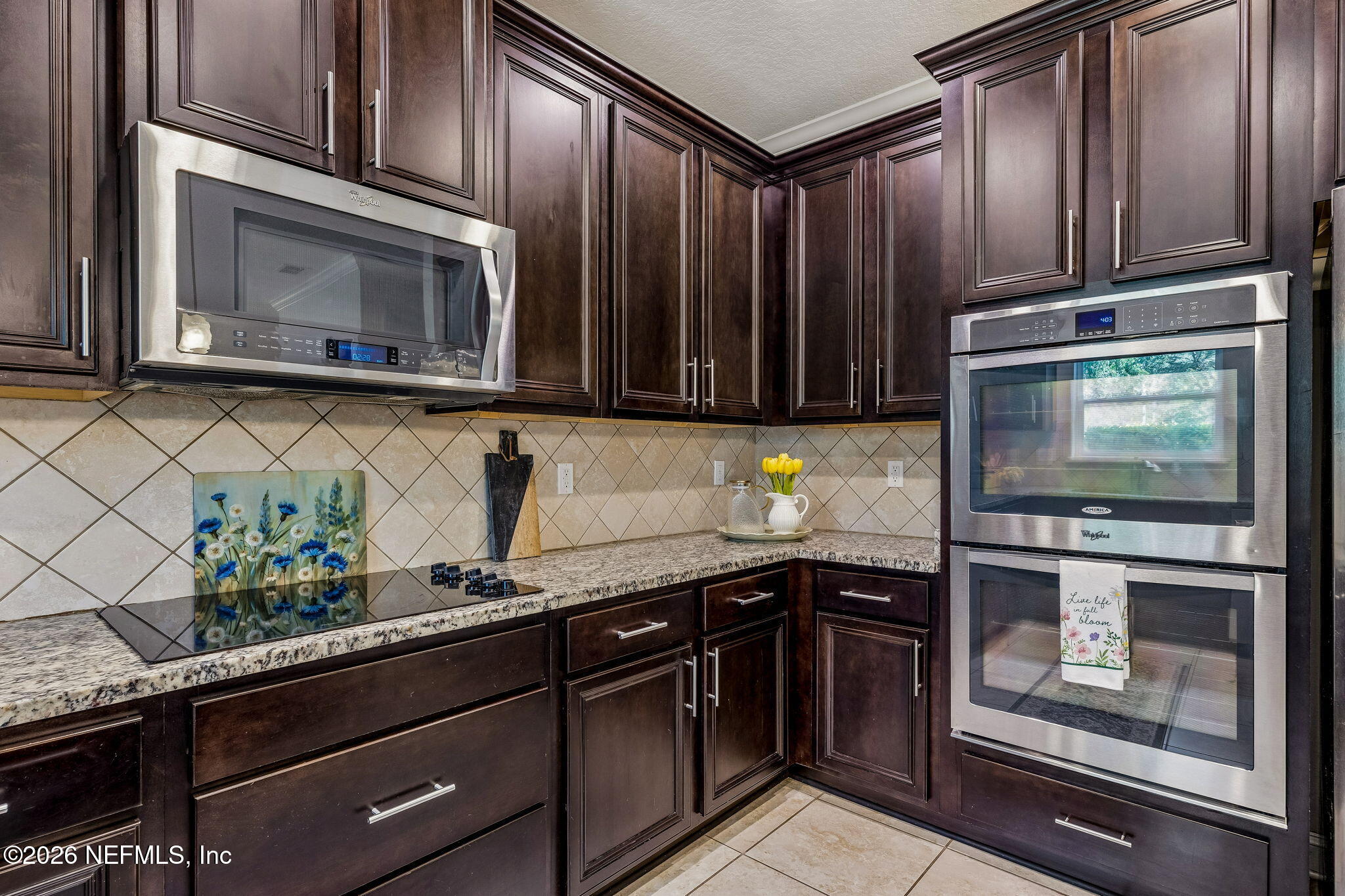 12198 Ridge Crossing Way Jacksonville, FL 32226 - Photo 17 of 67 a kitchen with granite countertop stainless steel appliances and cabinets