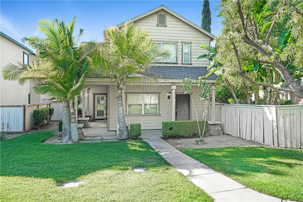 8502 Amy Court Riverside, CA 92504 - Photo 1 of 1 a front view of a house with a yard and green space