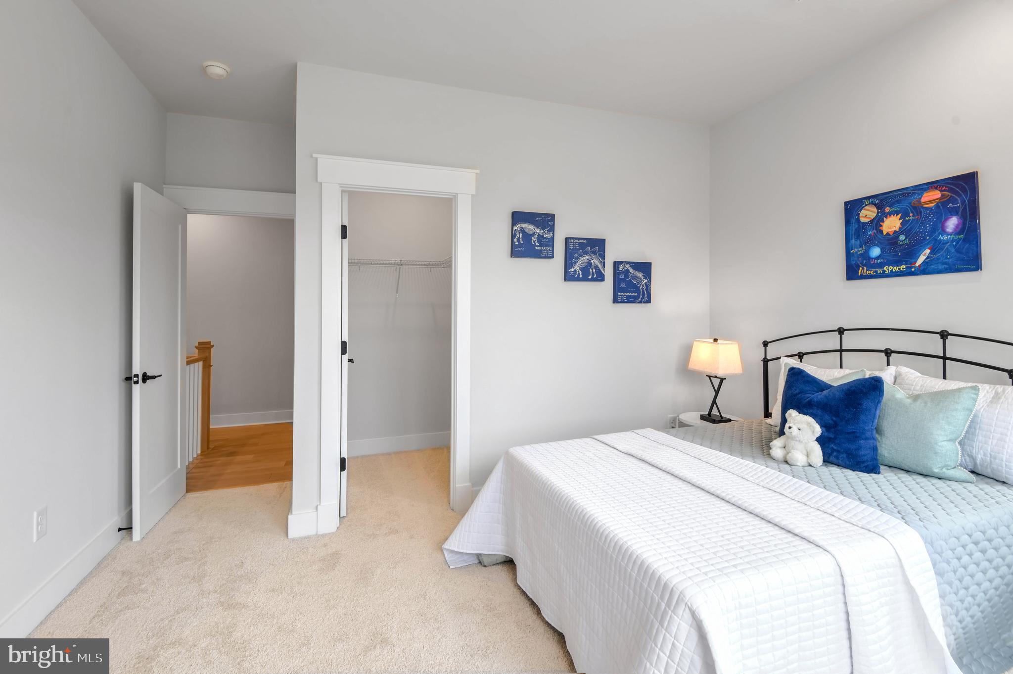 Eliana Court Laurel, MD 20708 - Photo 30 of 46 a bedroom with a bed and a view of en suite bathroom