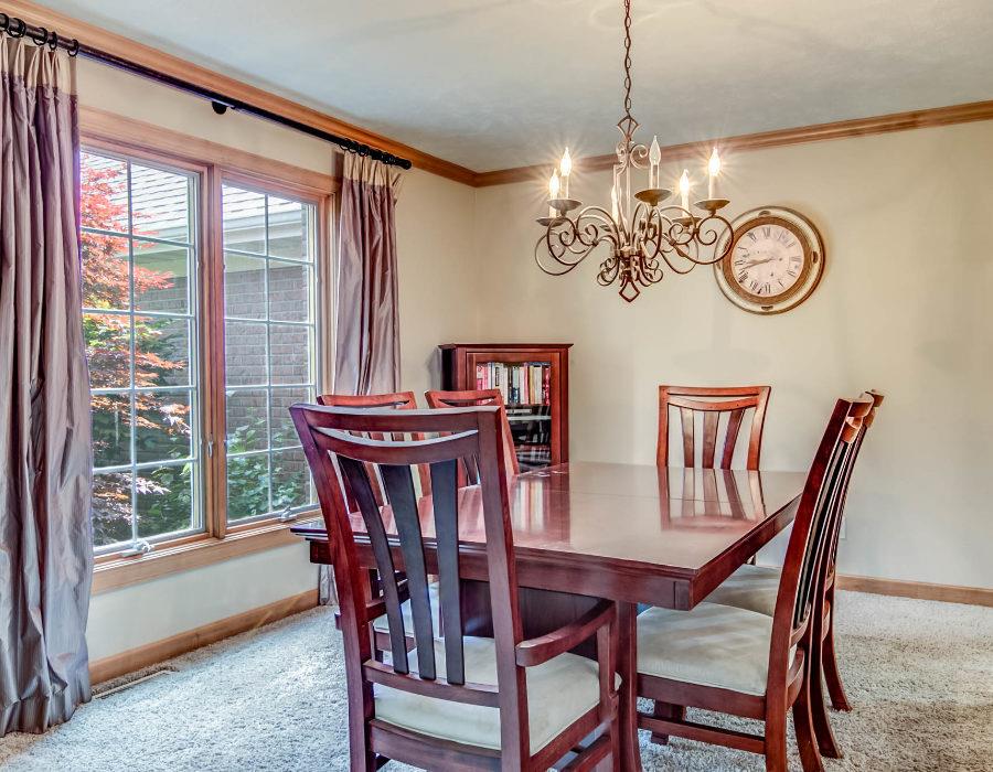 885 Spring Ridge Court Belvidere, IL 61008 - Photo 5 of 22 a view of a dining room with furniture window and a chandelier