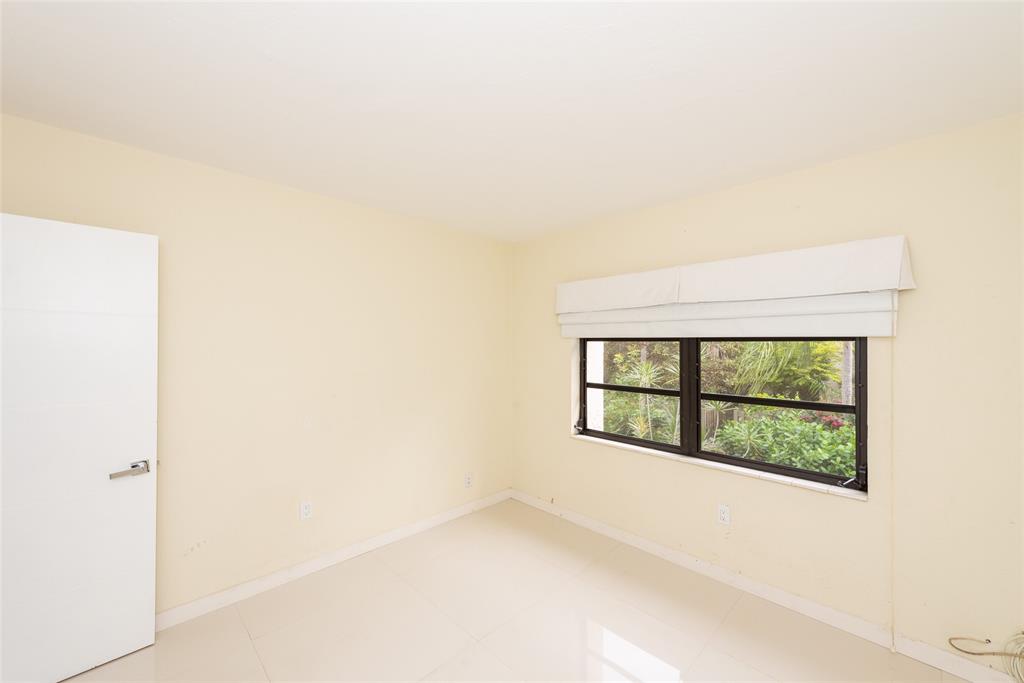 7925 Southwest 104th Street, Unit 203E Miami, FL 33156 - Photo 17 of 23 an empty room with windows
