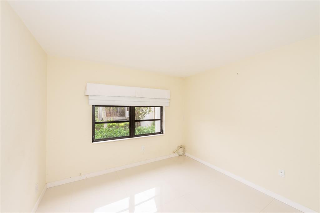 7925 Southwest 104th Street, Unit 203E Miami, FL 33156 - Photo 18 of 23 an empty room with a window