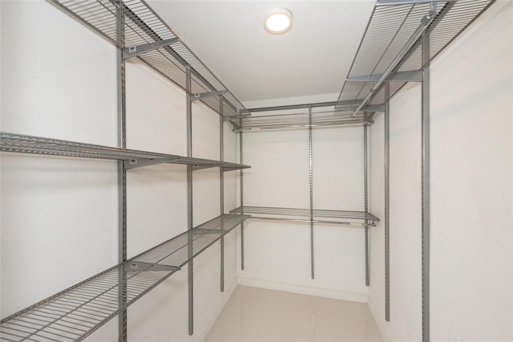 7925 Southwest 104th Street, Unit 203E Miami, FL 33156 - Photo 22 of 23 a view of an empty walk in closet