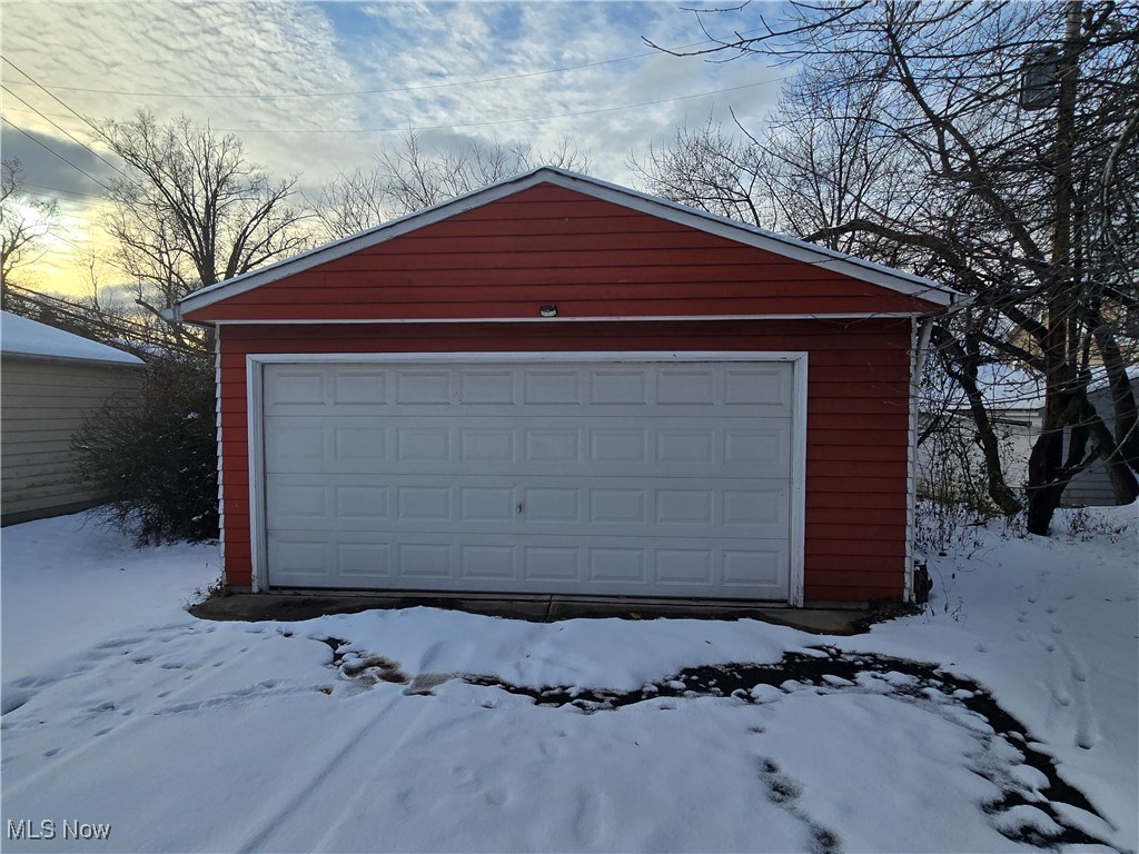 2048 Rossmoor Road Cleveland Heights, OH 44118 - Photo 4 of 29 Snow covered garage featuring a detached garage