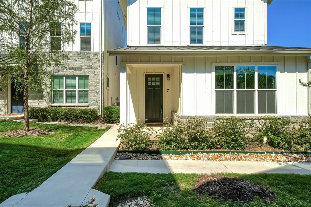 2624 Metcalfe Road, Unit 7 Austin, TX 78741 - Photo 1 of 1 front view of a brick house with a yard