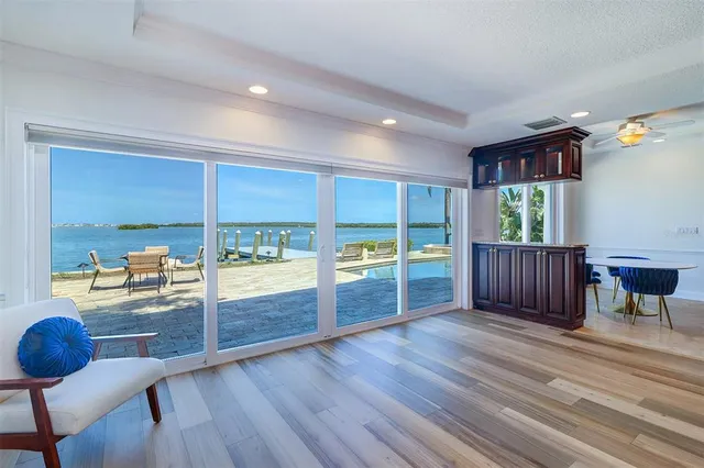 a view of a livingroom with furniture wooden floor and window