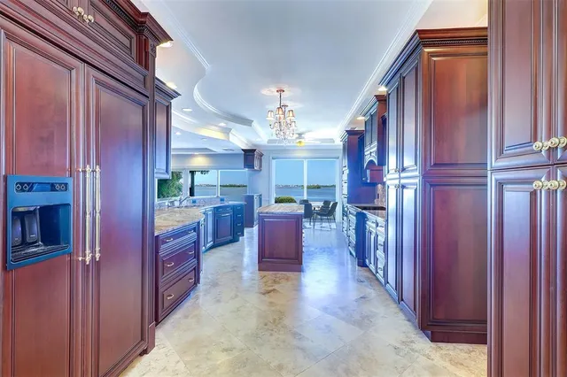 a view of kitchen with cabinets and window