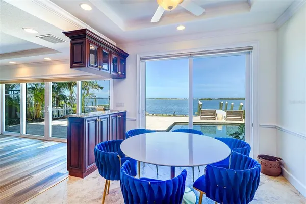 a view of a dining room with furniture window and wooden floor