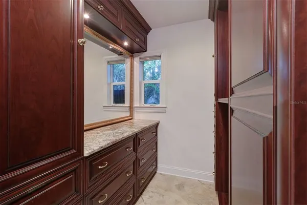 a view of cabinet and mirror