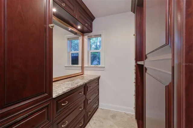 a view of cabinet and mirror