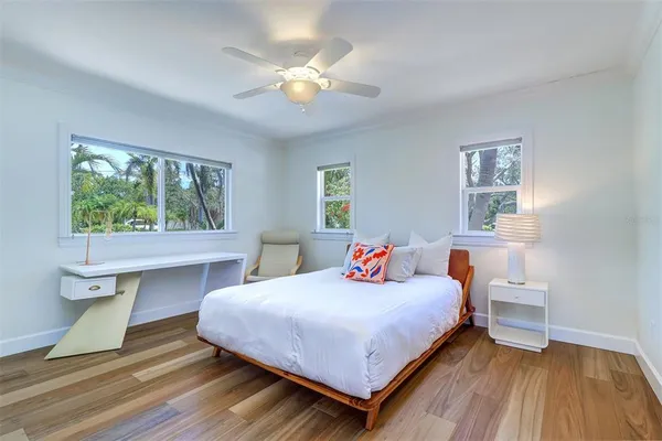 a bedroom with a bed and a table