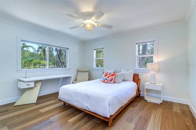 a bedroom with a bed and a table