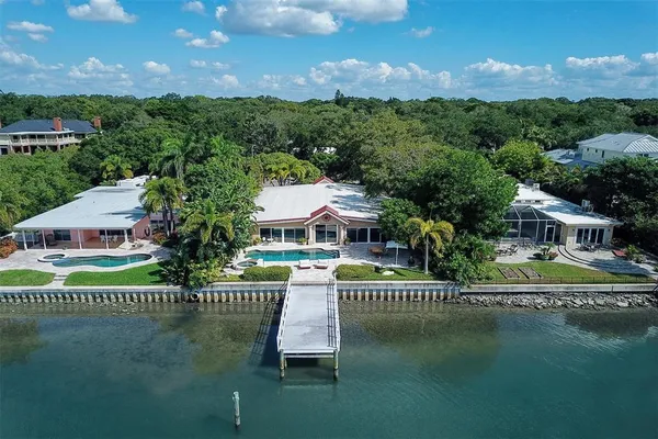 an aerial view of a residential houses with outdoor space