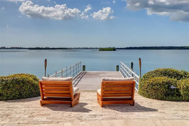 a backyard of a house with a table and chair