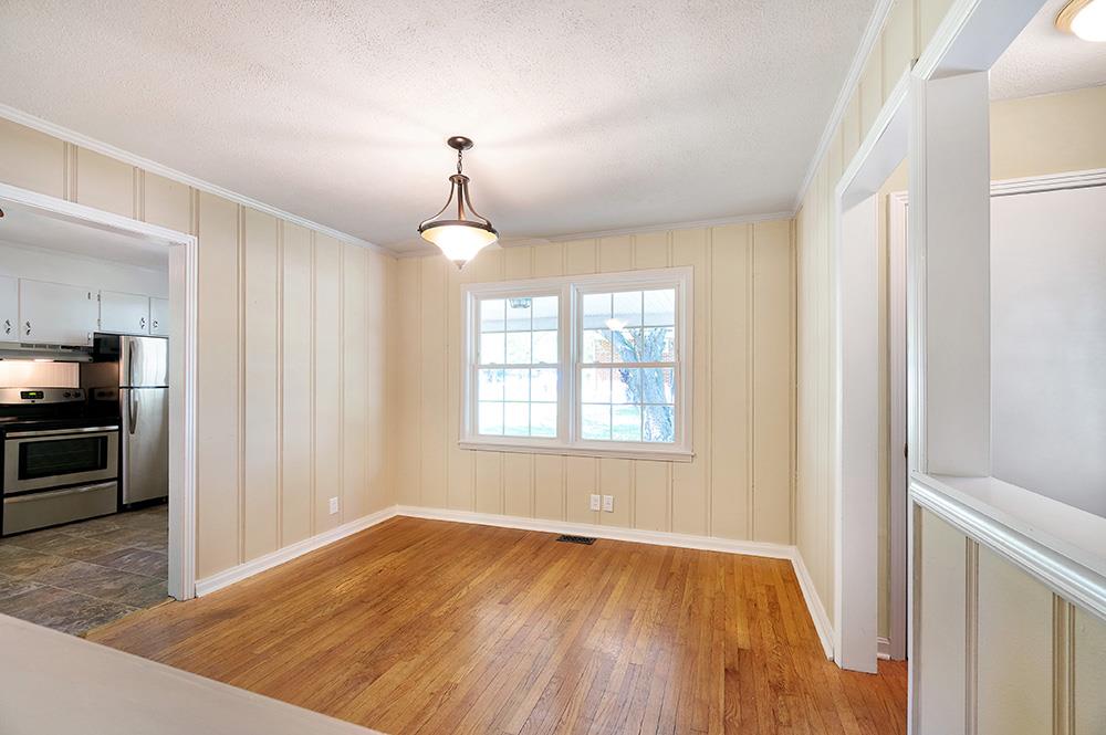 210 Pitt Lane Springfield, TN 37172 - Photo 13 of 27 an empty room with wooden floor and windows